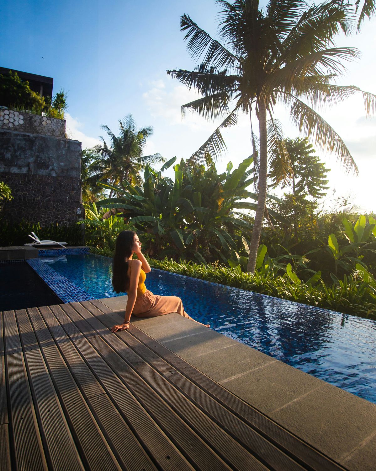 A woman relaxing by a jungle pool in Ubud, Bali